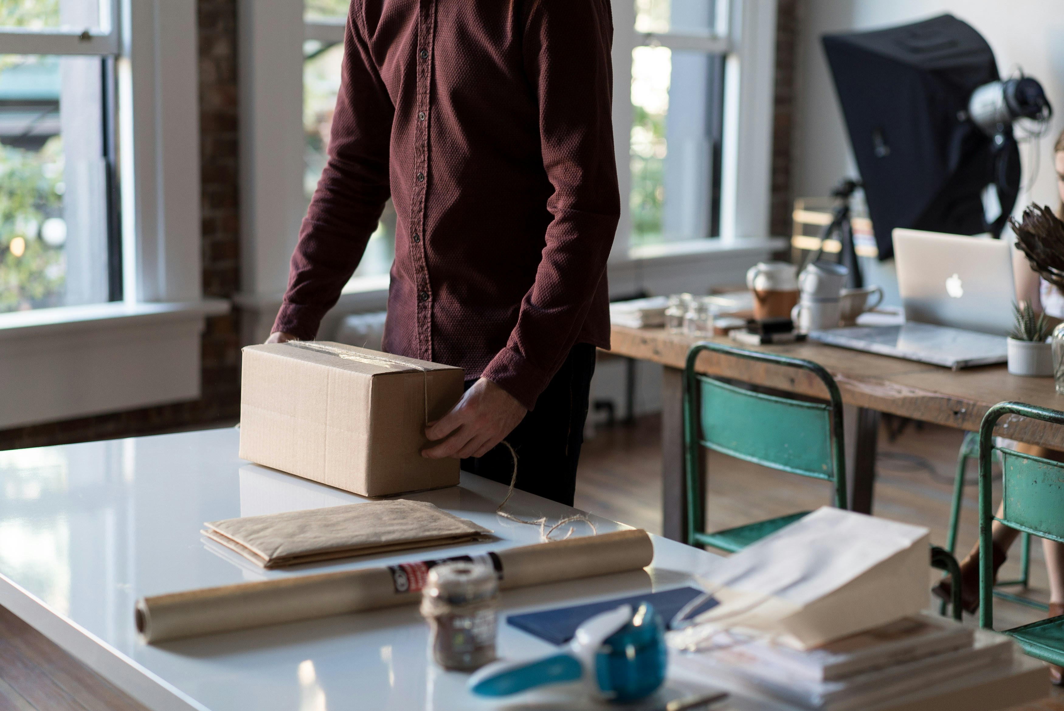 Small business owner preparing orders in their workspace
